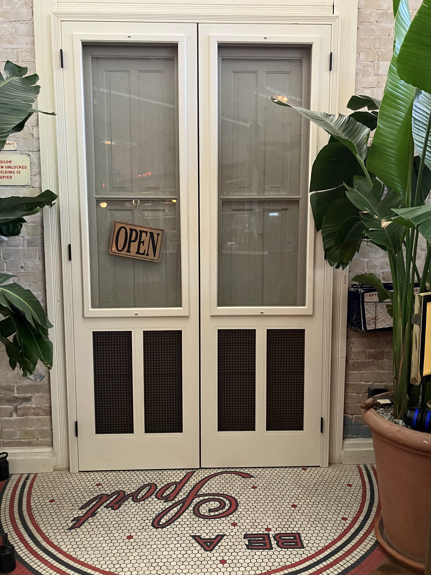Uptown Sports Club window and door restoration in progress
