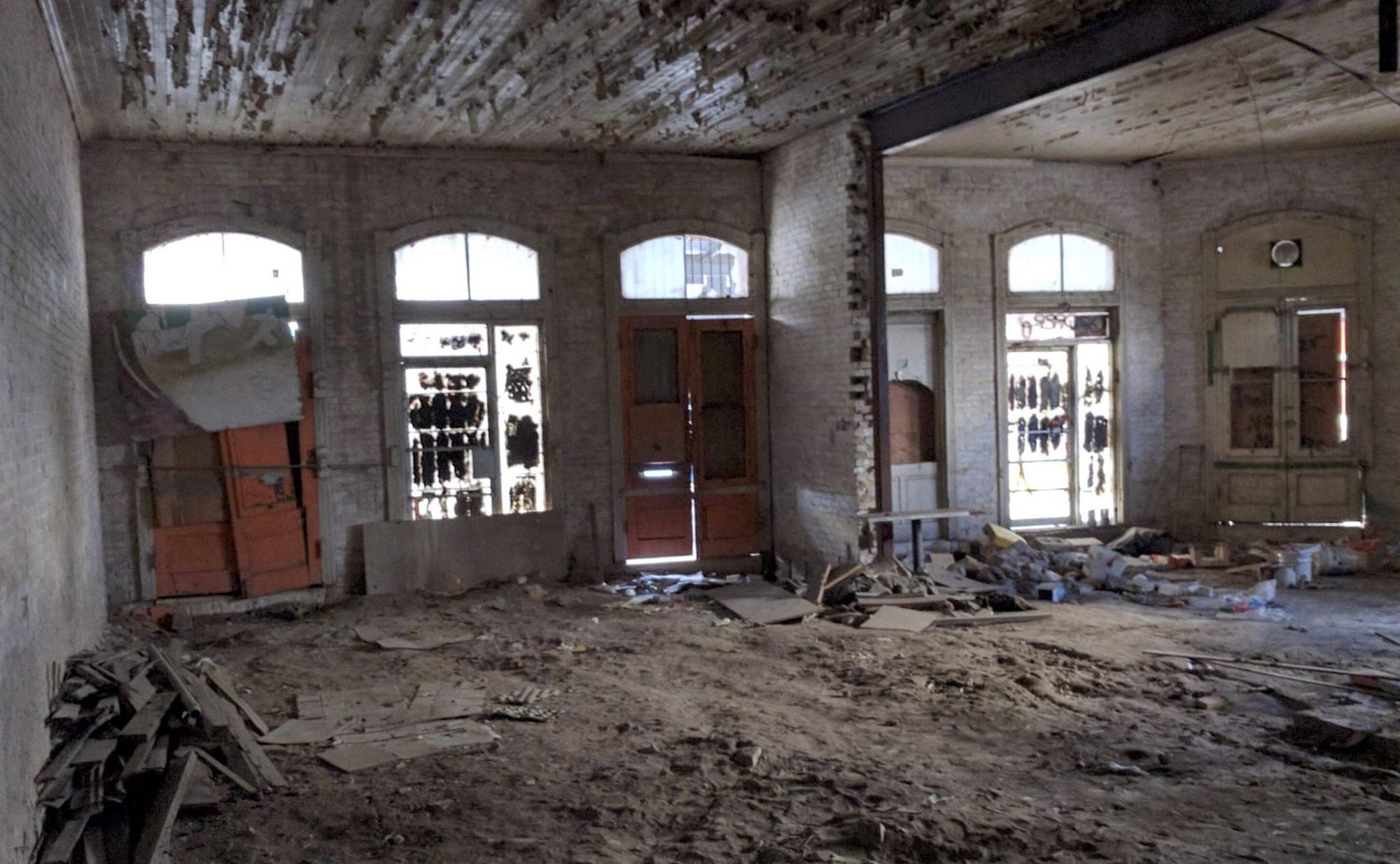 Uptown Sports Club window and door restoration in progress